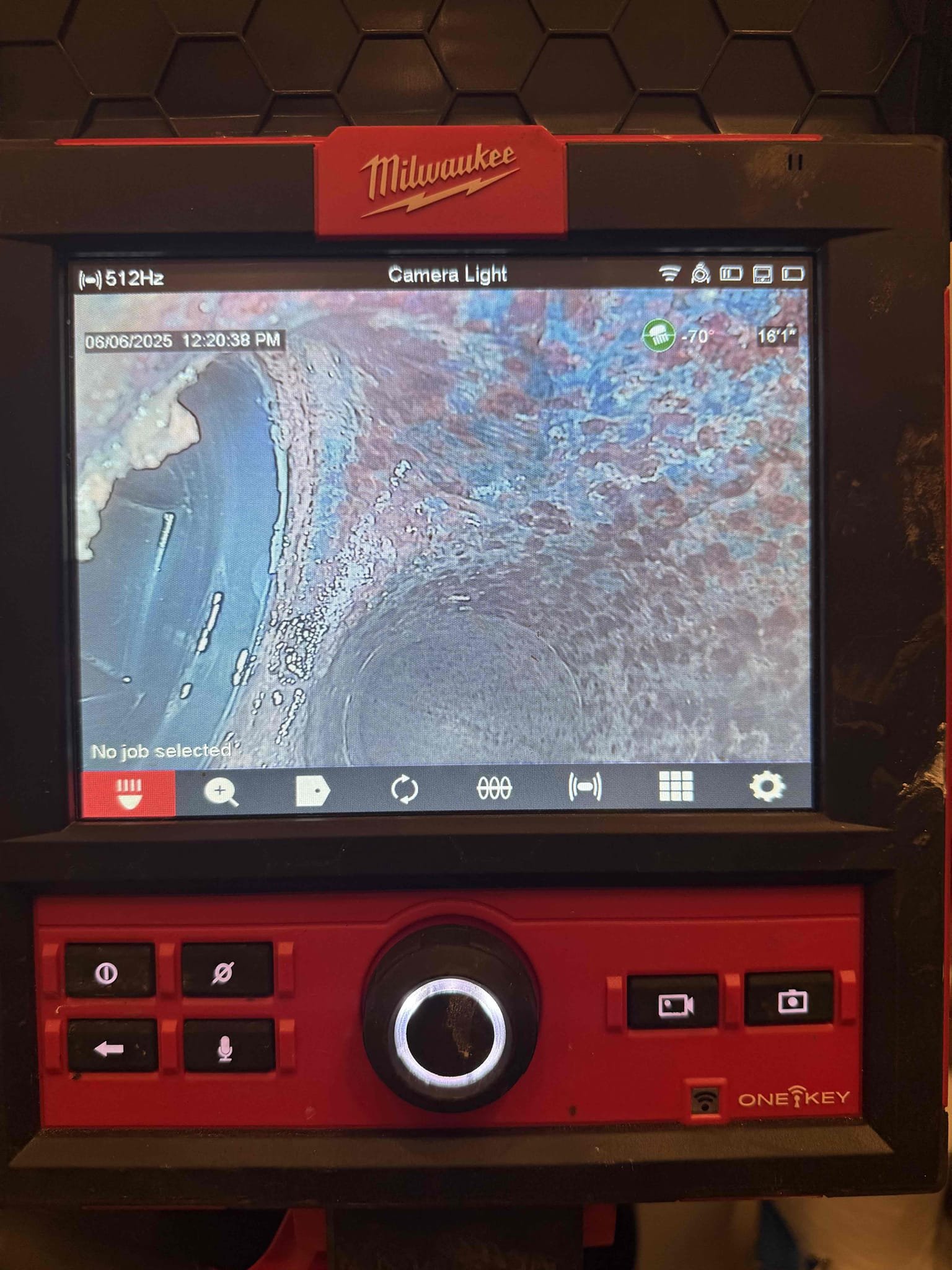 Camera view of a sewer line.