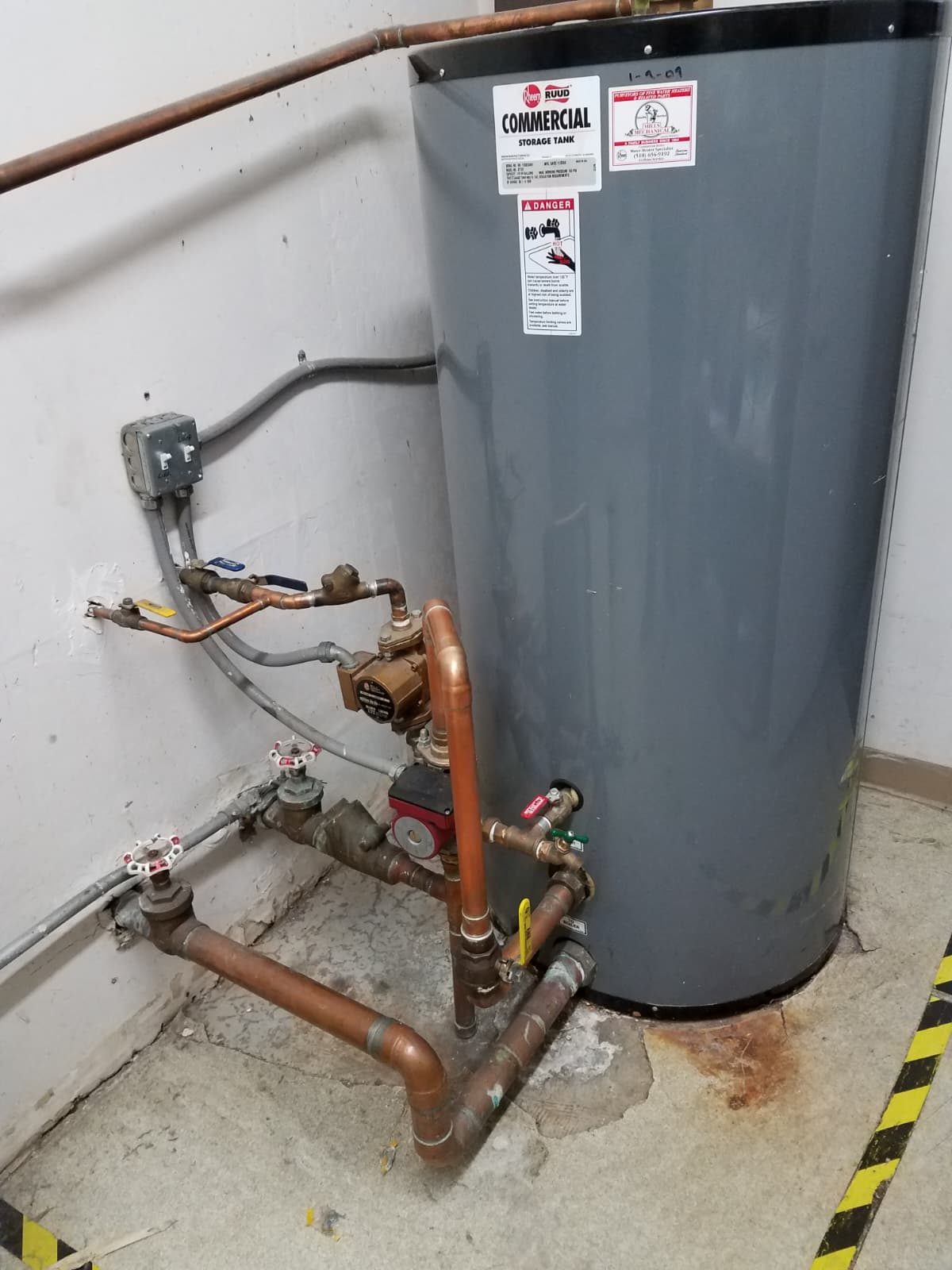 A professionally installed commercial water heater.