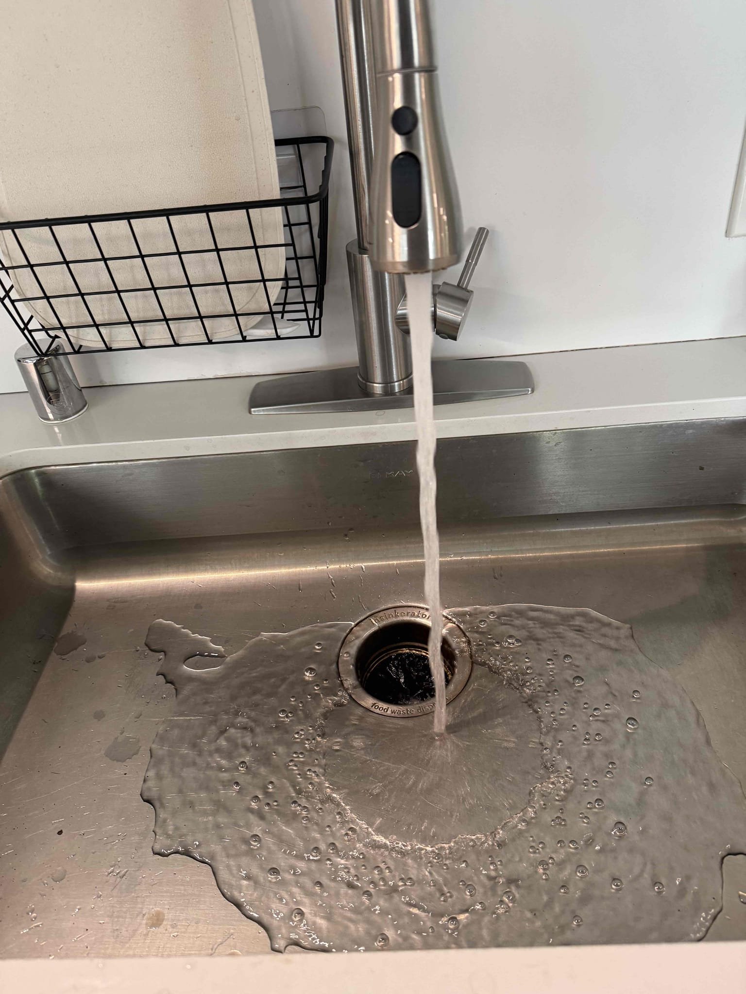 A running sink faucet after repairs.