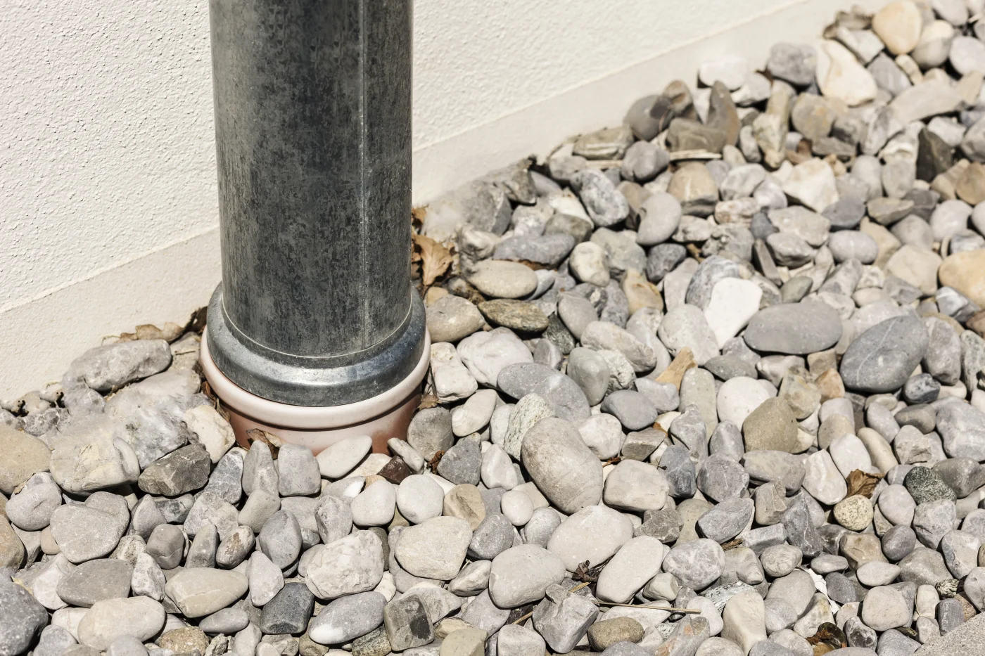 A large pipe leading into a foundation draining system.