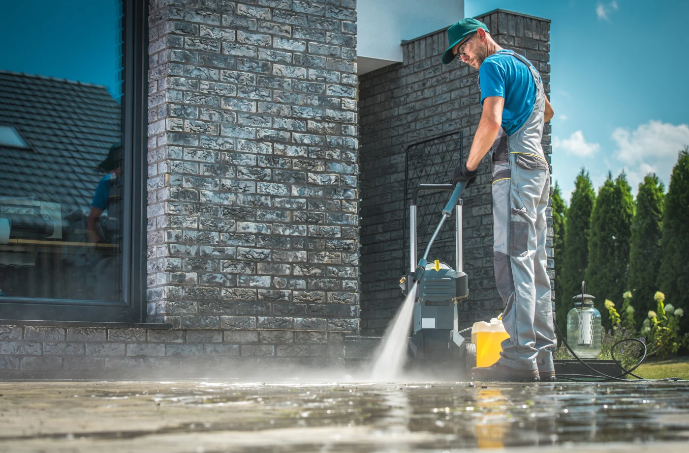 A plumber hydro-jetting outside a Hayward, CA home.