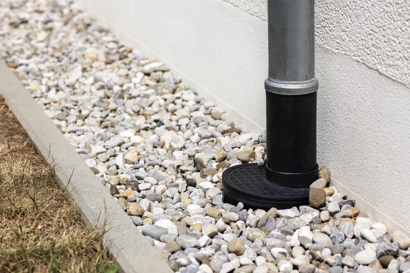 A foundation drain on the outside of a Hayward, CA home.