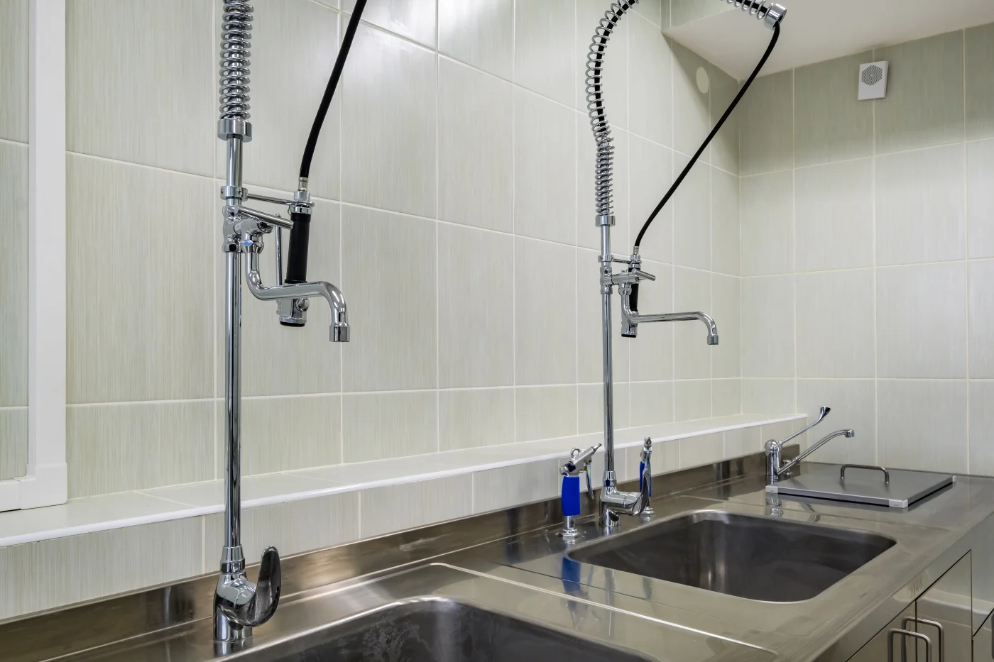 A restaurant kitchen that's depending on proper plumbing and drain services.