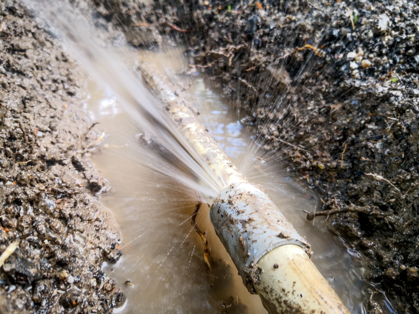A white PVC pipe in mud burst.