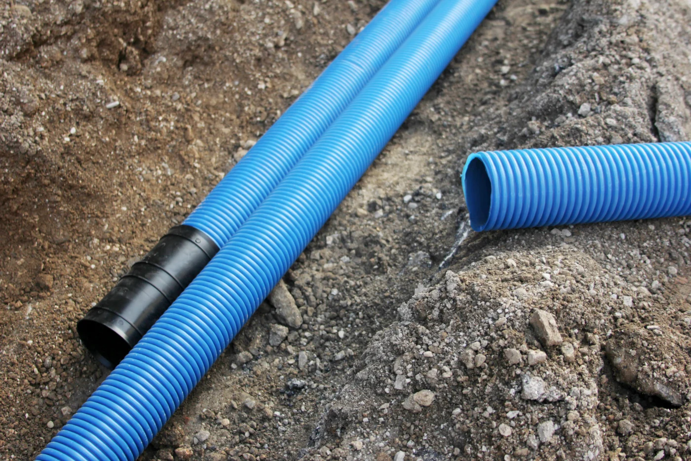 Trusted Sewer Line Replacement in Palo Alto, CA | Facilities Plumbing & Drain New blue sewer pipes in the dirt on a job site.