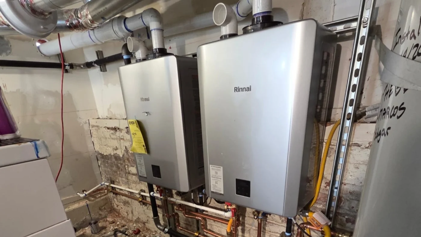 Expert Water Heater Installation Berkeley Ca Facilities Plumbing & Drain Two wall-mounted Rinnai tankless water heaters installed with exposed piping and ventilation