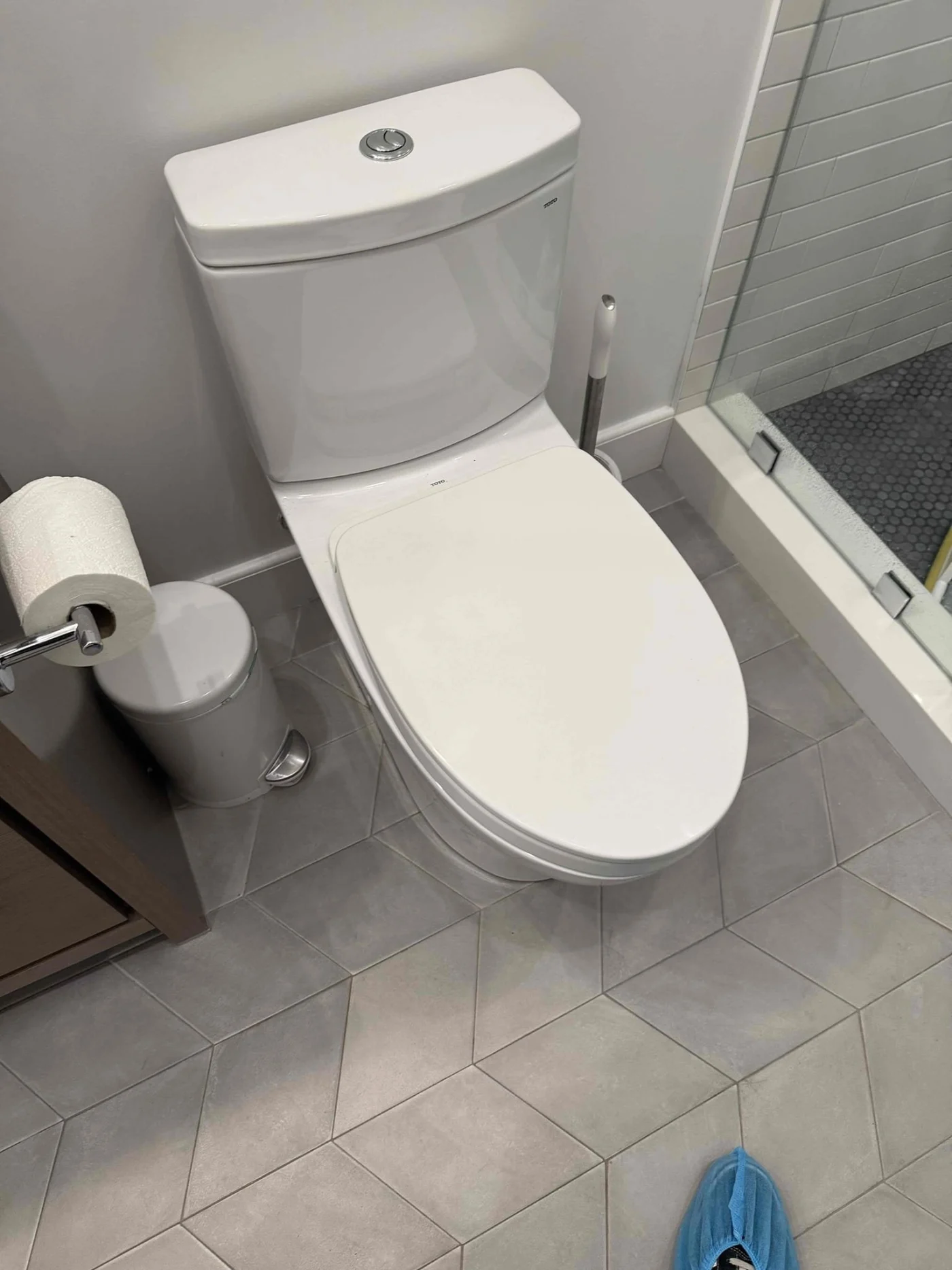 Under-sink plumbing with garbage disposal, drain trap, supply lines, and shut-off valves visible inside a cabinet.